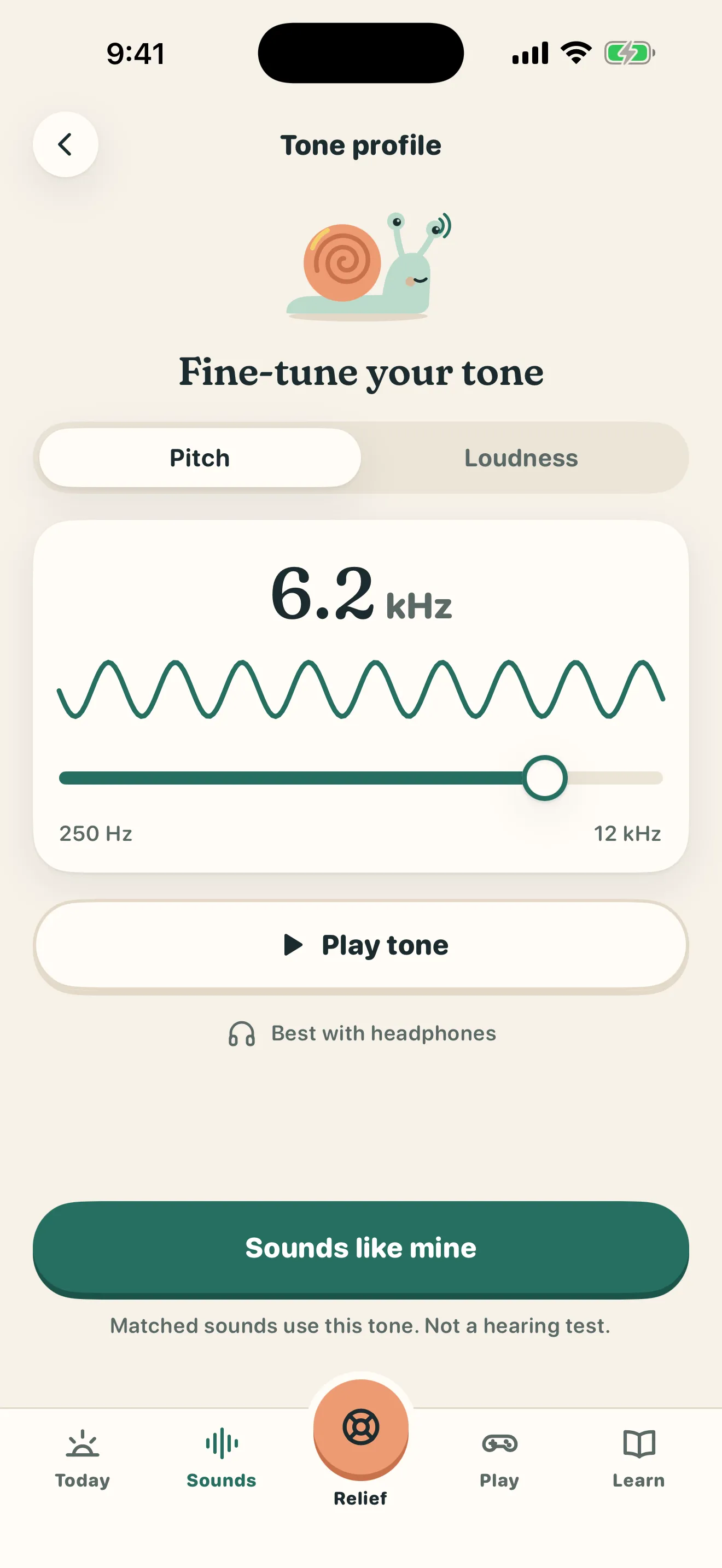 Tinnimo Tone profile screen with Coco the snail above a pitch slider set to 6.2 kHz on a scale from 250 Hz to 12 kHz, a Play tone button and a Sounds like mine button. A note says it is not a hearing test.